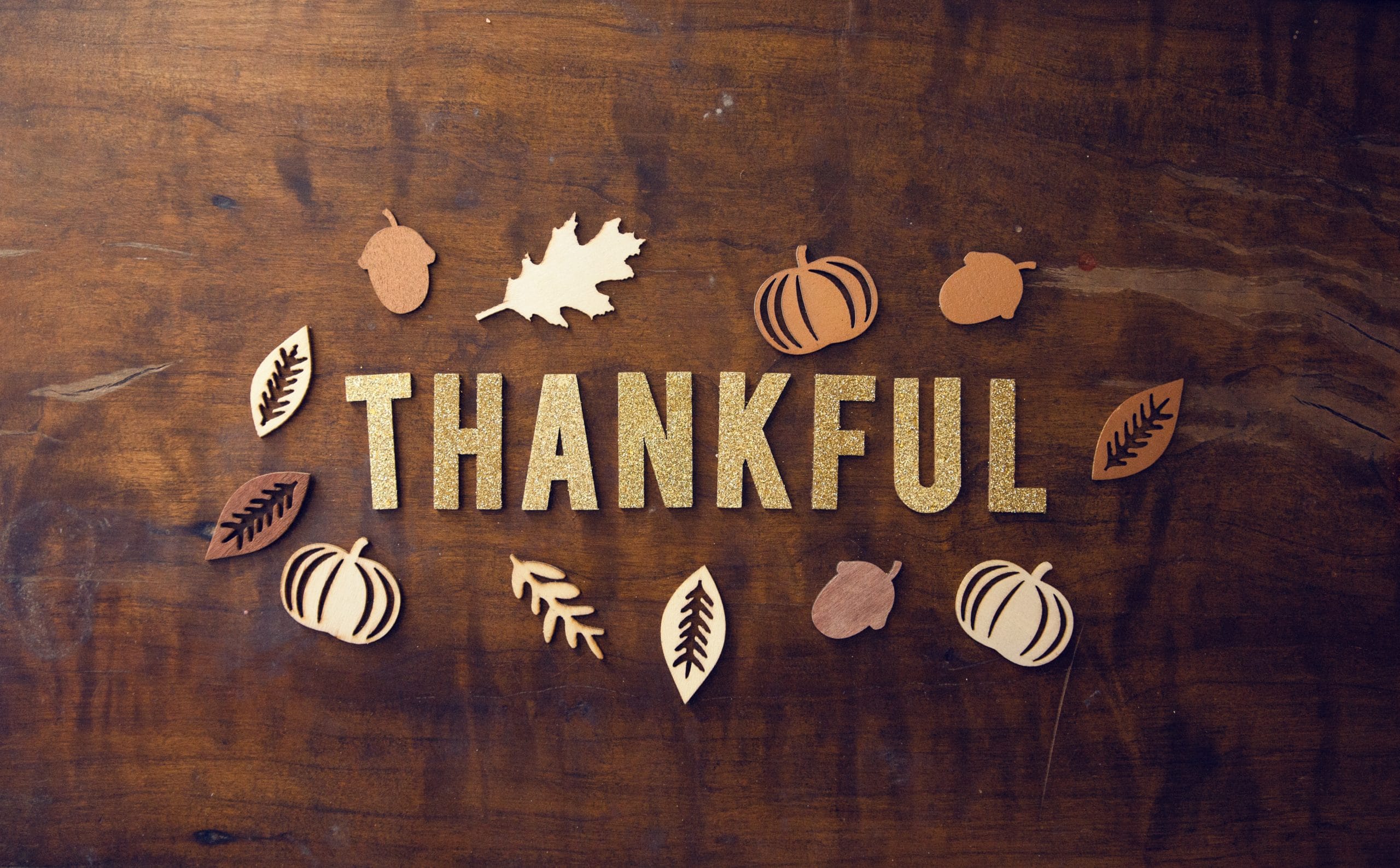 Word "thankful" with autumn symbols