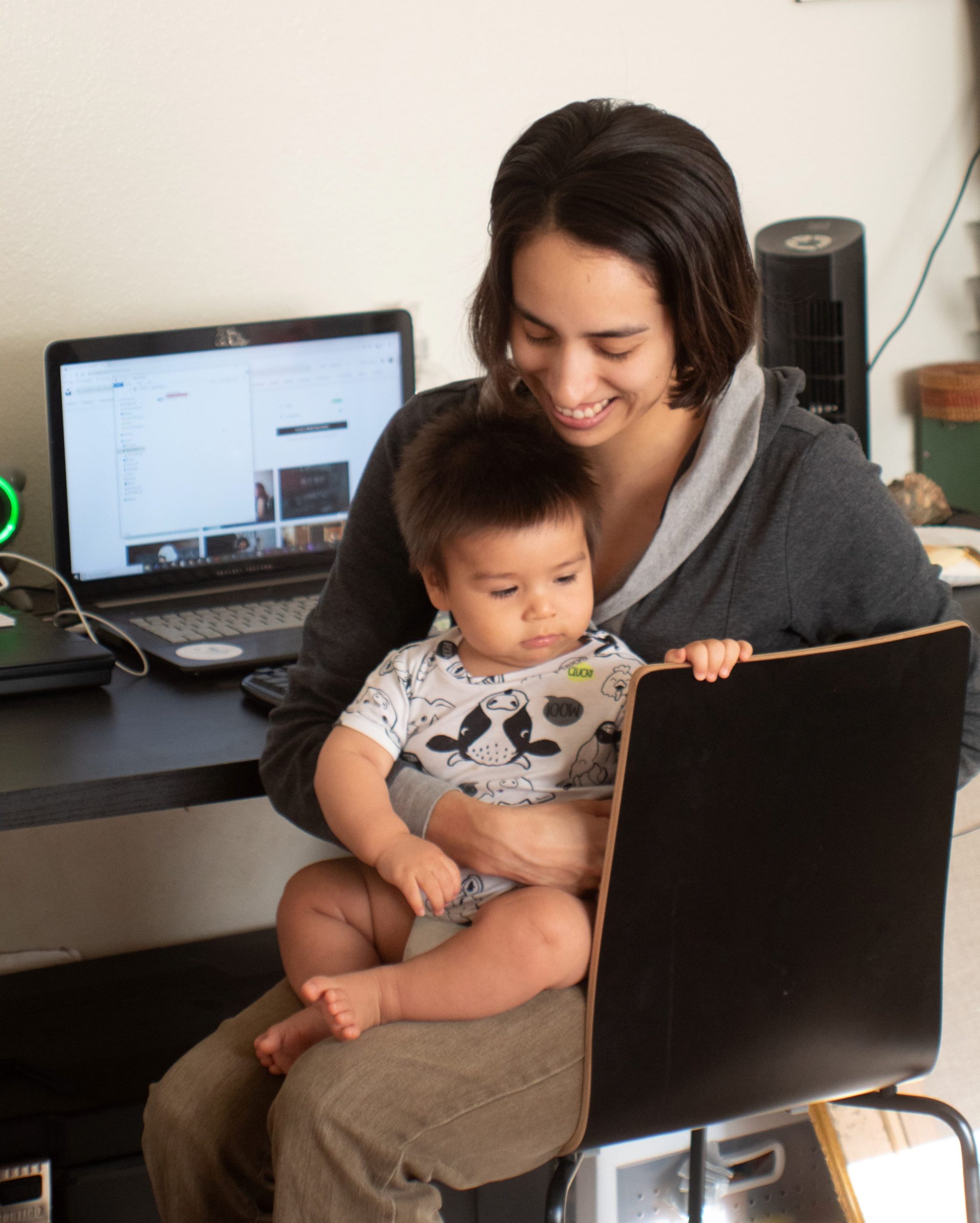 Woman with baby and laptop