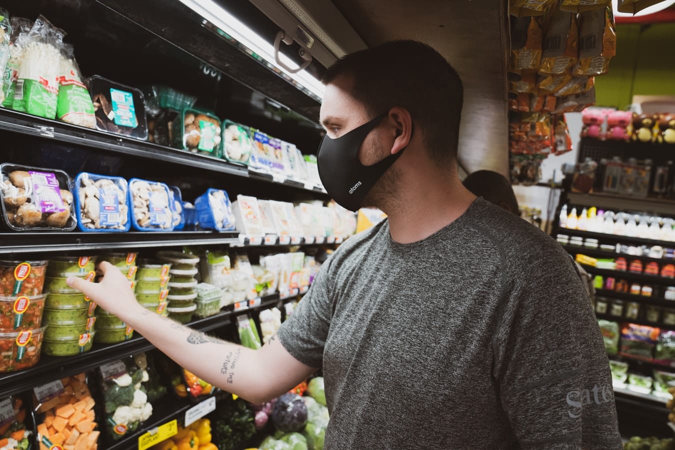 man with face mask in grocery store
