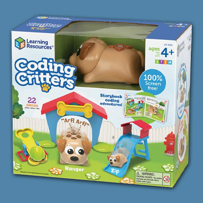 blue background with coding critter toy box. on the box there is a brown puppy toy in front of its dog house, next to it are some colorful dog toys.