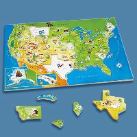 A wooden map of the USA puzzle kit with a blue background.