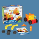 A toy yellow and red construction truck