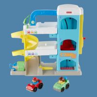 A three level toy car garage with a slide for a red and green toy cars