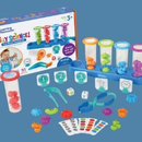 A children's science kit that includes rainbow test tubes, flashcards, and tools