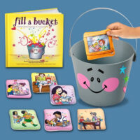 Title: Social-Emotional Storytelling Kit with bucket and 10 soft pillow pieces and hardcover book.
